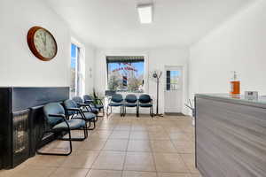 Sitting room with light tile patterned floors