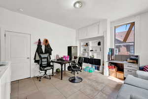 Office space featuring light tile patterned floors