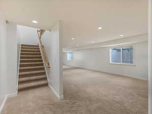 Stairway featuring carpet flooring