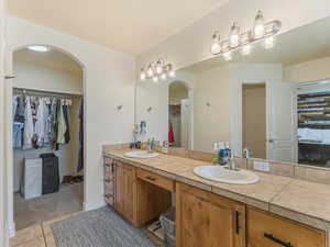 Bathroom featuring tile patterned floors and vanity