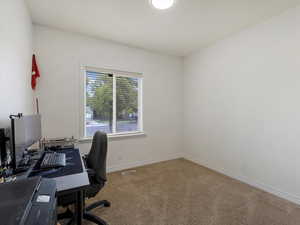 View of carpeted home office