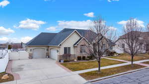 Large 3 car garage and RV parking in front of and behind the fence