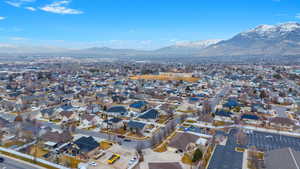 Birds eye view of property with a mountain view