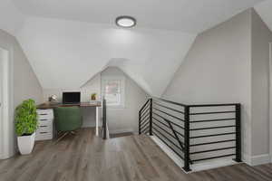 Office featuring light hardwood / wood-style flooring and vaulted ceiling