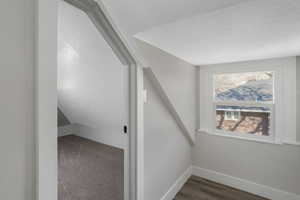 Additional living space featuring a textured ceiling