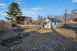 View of yard with an outbuilding and a mountain view