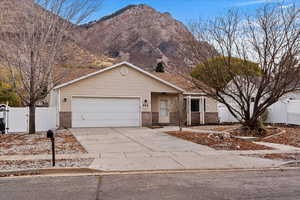 Ranch-style house with a mountain view and a garage