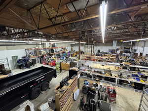 Miscellaneous room with a workshop area and concrete floors