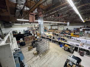 Miscellaneous room featuring a workshop area and concrete flooring