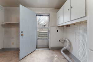 Laundry room with cabinets