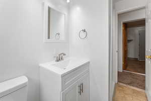 Bathroom with toilet and vanity