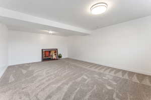 Basement with carpet flooring