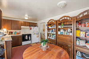 Kitchen featuring sink and white appliances