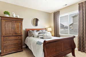 View of main level carpeted bedroom