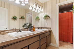 Bathroom #4 with vanity, a shower with curtain, and tile patterned flooring