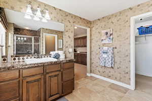 Primary suite bathroom #2 with sink and an enclosed shower