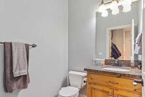 Bathroom featuring toilet and vanity