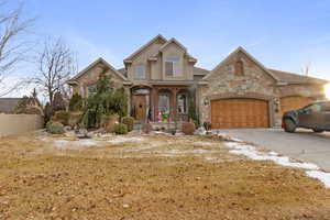 View of front of property with a garage