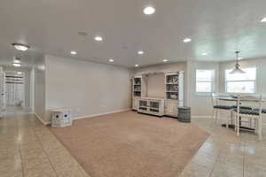 Interior space featuring a textured ceiling