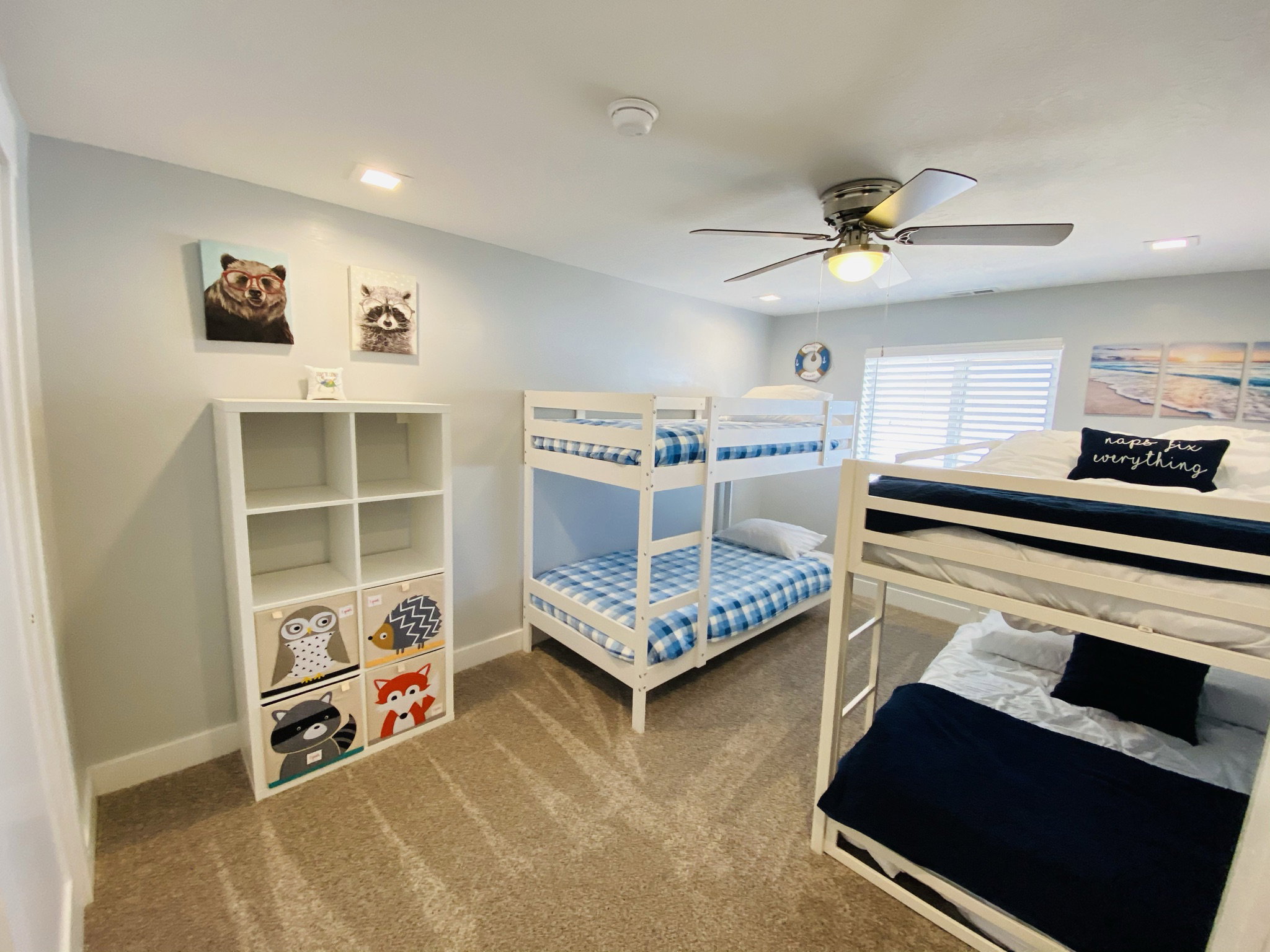 Carpeted bedroom with ceiling fan