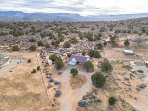 Birds eye view of property featuring a mountain view