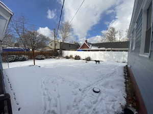 View of yard covered in snow