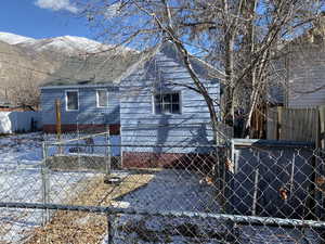 View of snow covered exterior with a mountain view