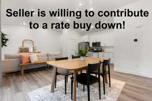 Dining area featuring light wood-style flooring, baseboards, and recessed lighting
