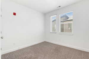 Second bedroom with carpet flooring