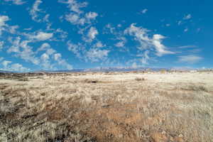 View of local wilderness with a rural view and a mountain view