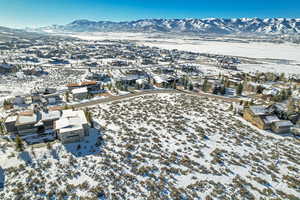 Snowy aerial view featuring a mountain view