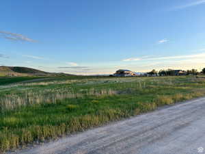 View of street with a rural view and a mountain view