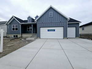 View of front facade featuring a garage