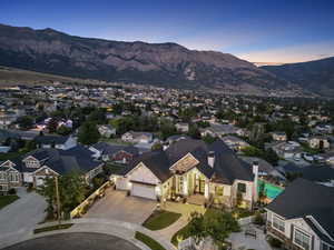 Aerial view at dusk featuring a mountain view