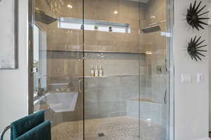 Bathroom with a shower with shower door