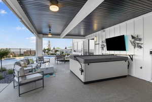 View of patio featuring outdoor lounge area and a fenced in pool