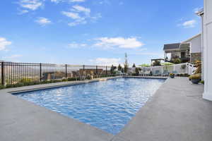 View of swimming pool featuring a patio area