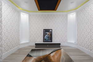 Room details featuring wood-type flooring and crown molding