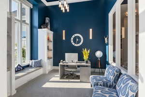 Carpeted office featuring plenty of natural light and crown molding