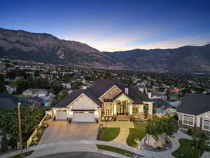 View of front facade with french doors and a mountain view