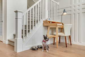 Stairway with hardwood / wood-style flooring