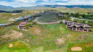 Birds eye view of property with a mountain view