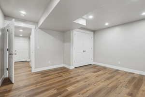 Basement featuring hardwood / wood-style flooring