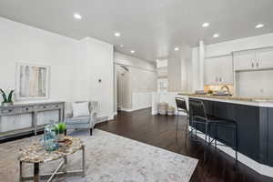 Great room with dark hardwood / wood-style floors