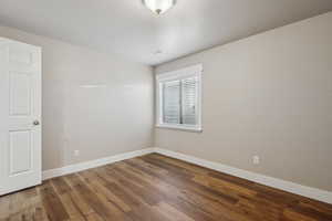 Empty room featuring hardwood / wood-style floors