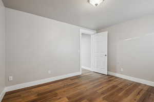 Spare room featuring hardwood / wood-style flooring