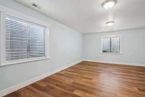 Spare room featuring hardwood / wood-style floors