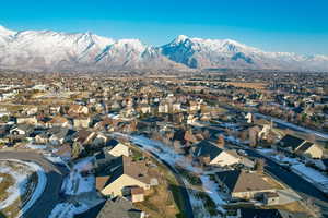 Snowy aerial view featuring a mountain view