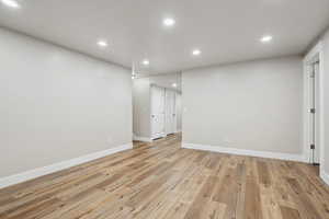 Spare room featuring light wood-type flooring