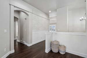 Hall featuring dark hardwood / wood-style floors